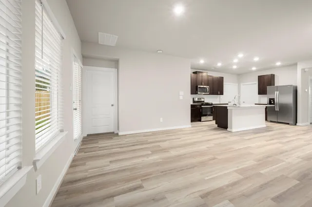 a view of a kitchen with a sink and a microwave