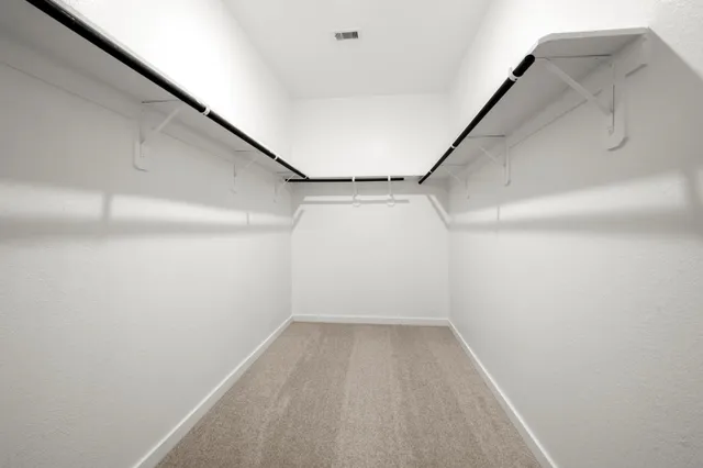 a view of a room with racks on the wall