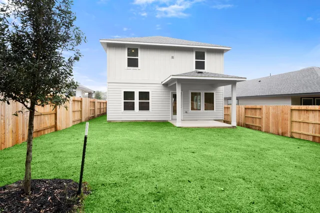 a front view of a house with yard