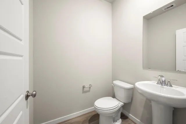 a bathroom with a sink and a toilet