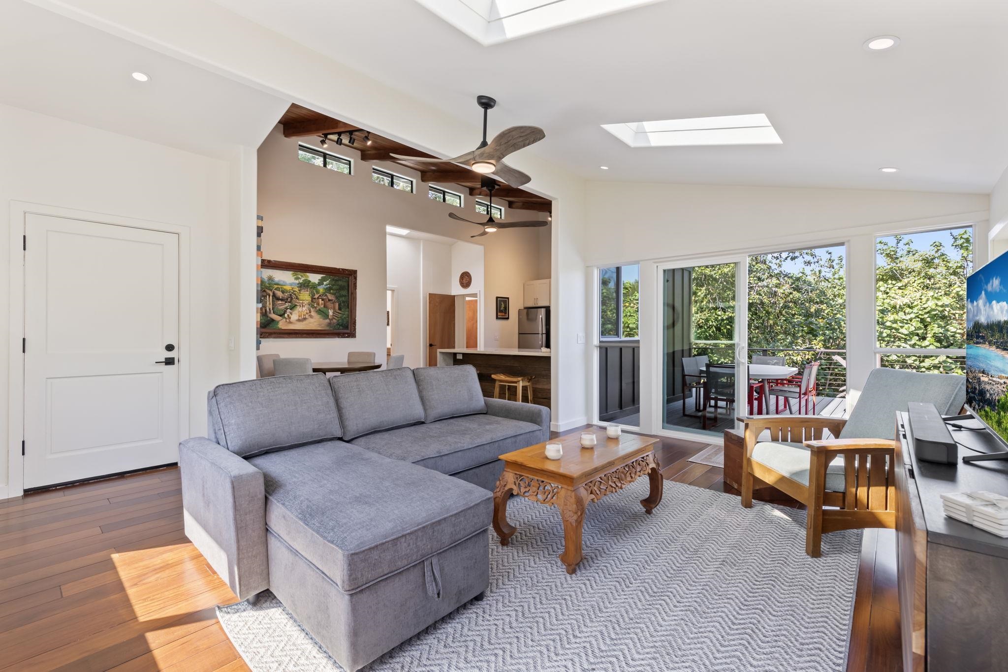 153 West Waipio Road Haiku, HI 96708 - Photo 1 of 15 a living room with furniture and a large window
