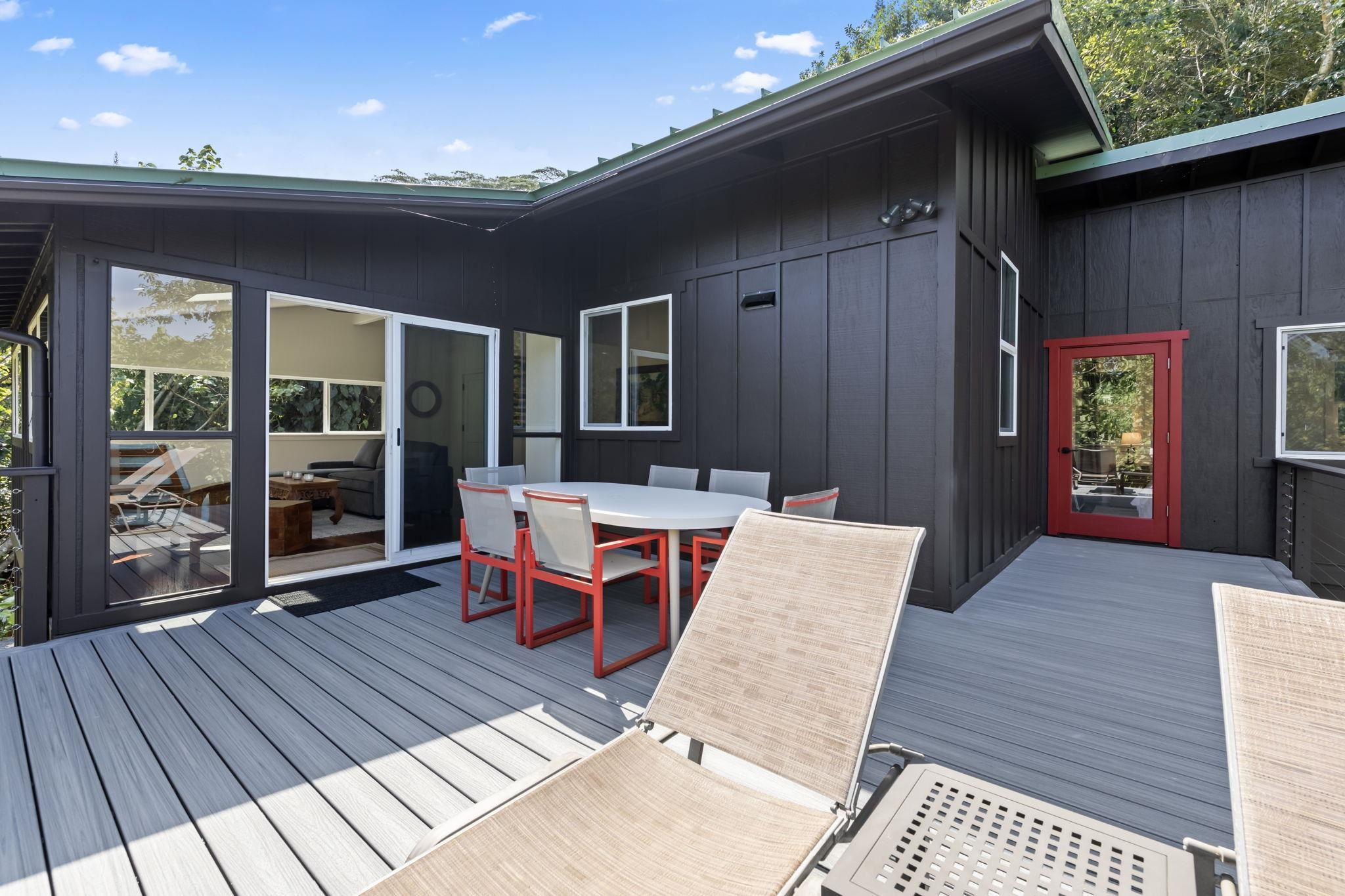 153 West Waipio Road Haiku, HI 96708 - Photo 13 of 15 a backyard of a house with barbeque oven table and chairs