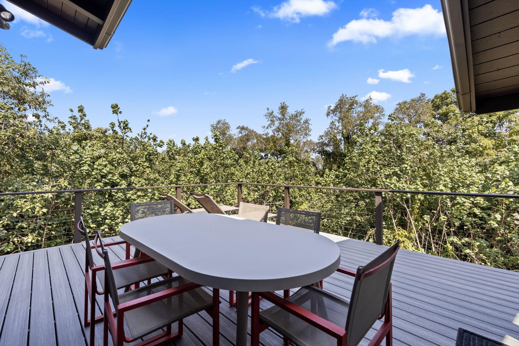 153 West Waipio Road Haiku, HI 96708 - Photo 14 of 15 a view of a balcony with a table and chairs
