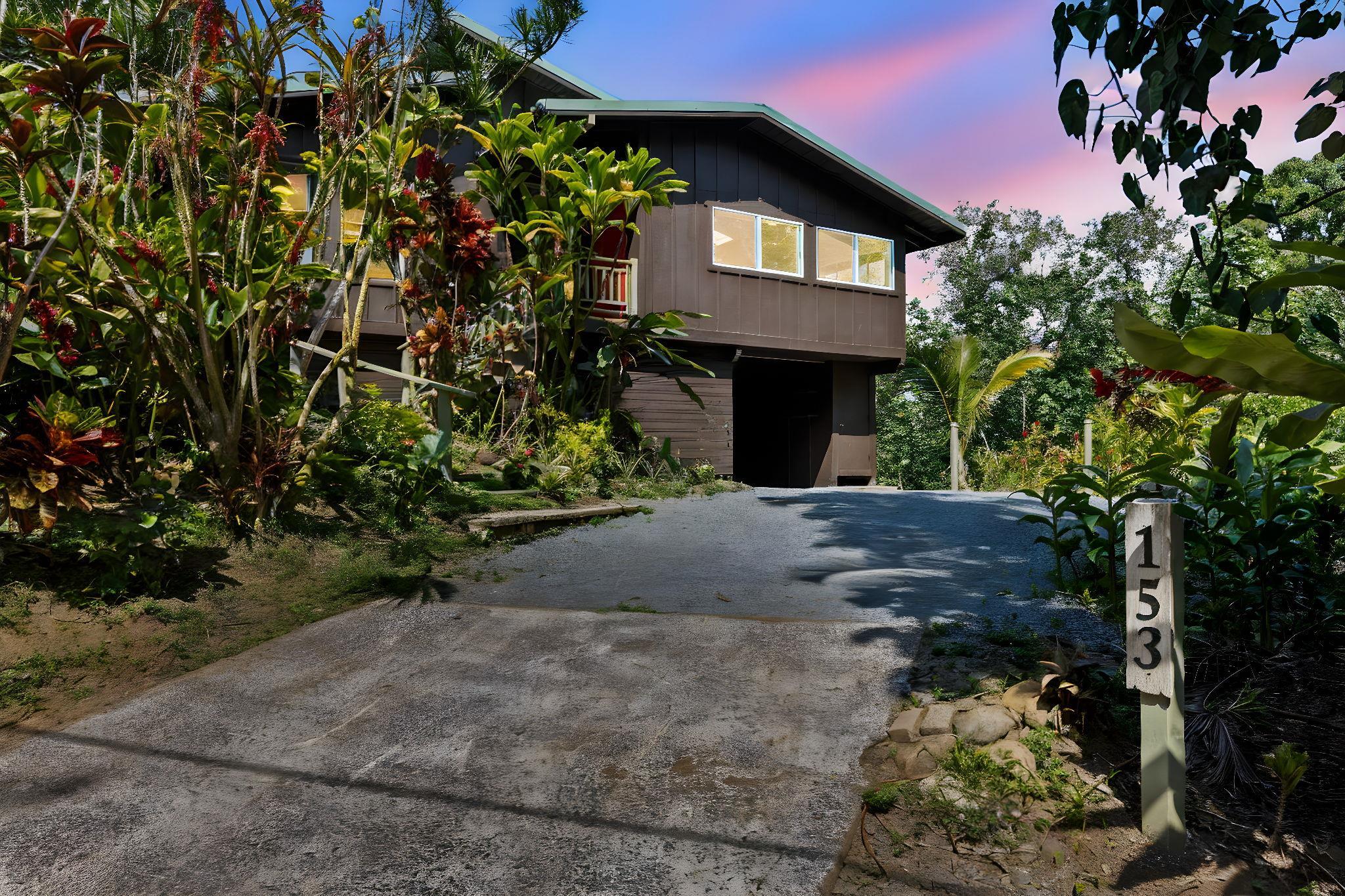 153 West Waipio Road Haiku, HI 96708 - Photo 3 of 15 a front view of a house with a yard