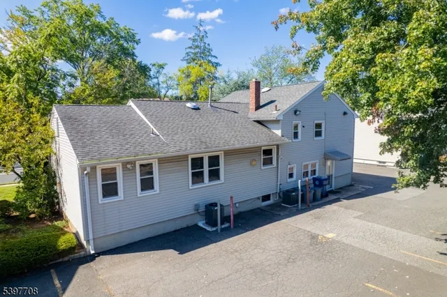 a house view with a sitting space and garden