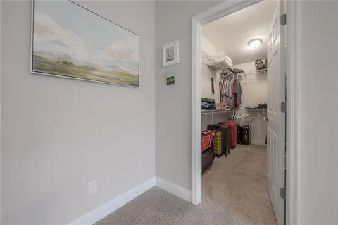 a view of a hallway with workspace and a hallway