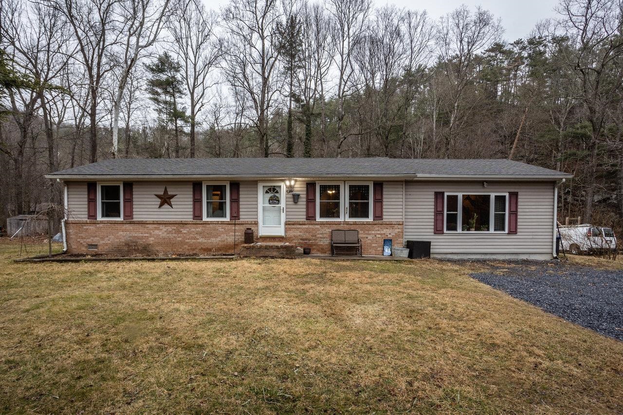 8448 Briery Branch Road Dayton, VA 22821 - Photo 1 of 37 a house that has a tree in front of it