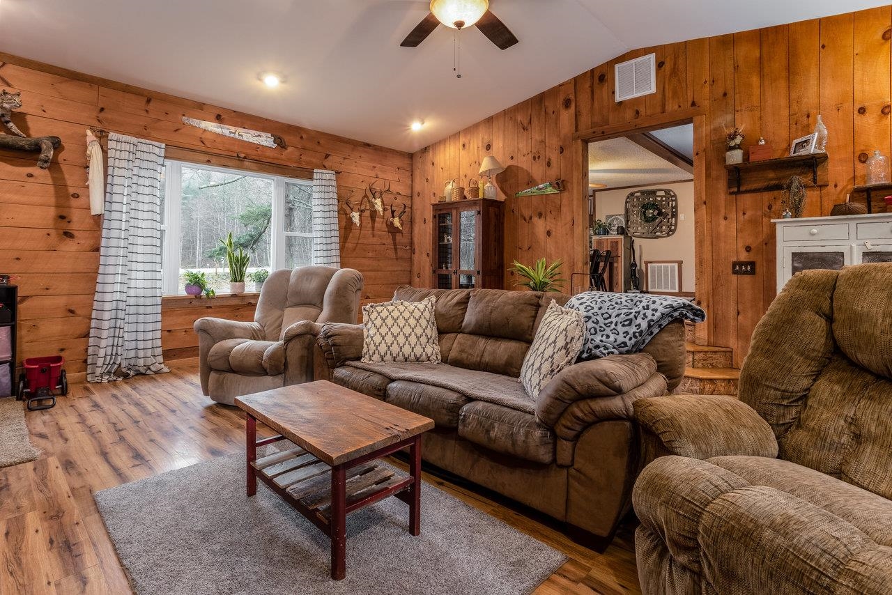 8448 Briery Branch Road Dayton, VA 22821 - Photo 15 of 37 a living room with furniture a large window and a chandelier