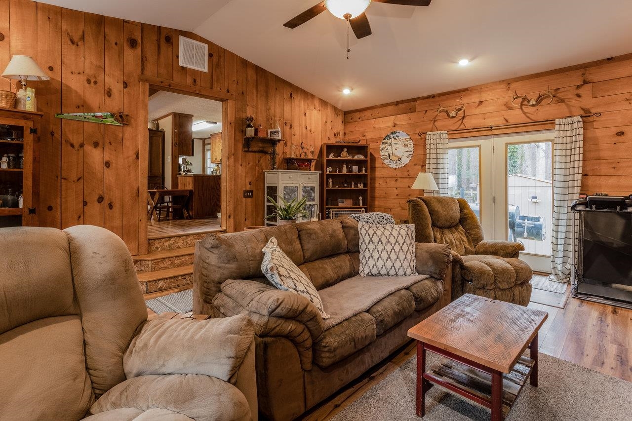 8448 Briery Branch Road Dayton, VA 22821 - Photo 17 of 37 a living room with furniture and a flat screen tv
