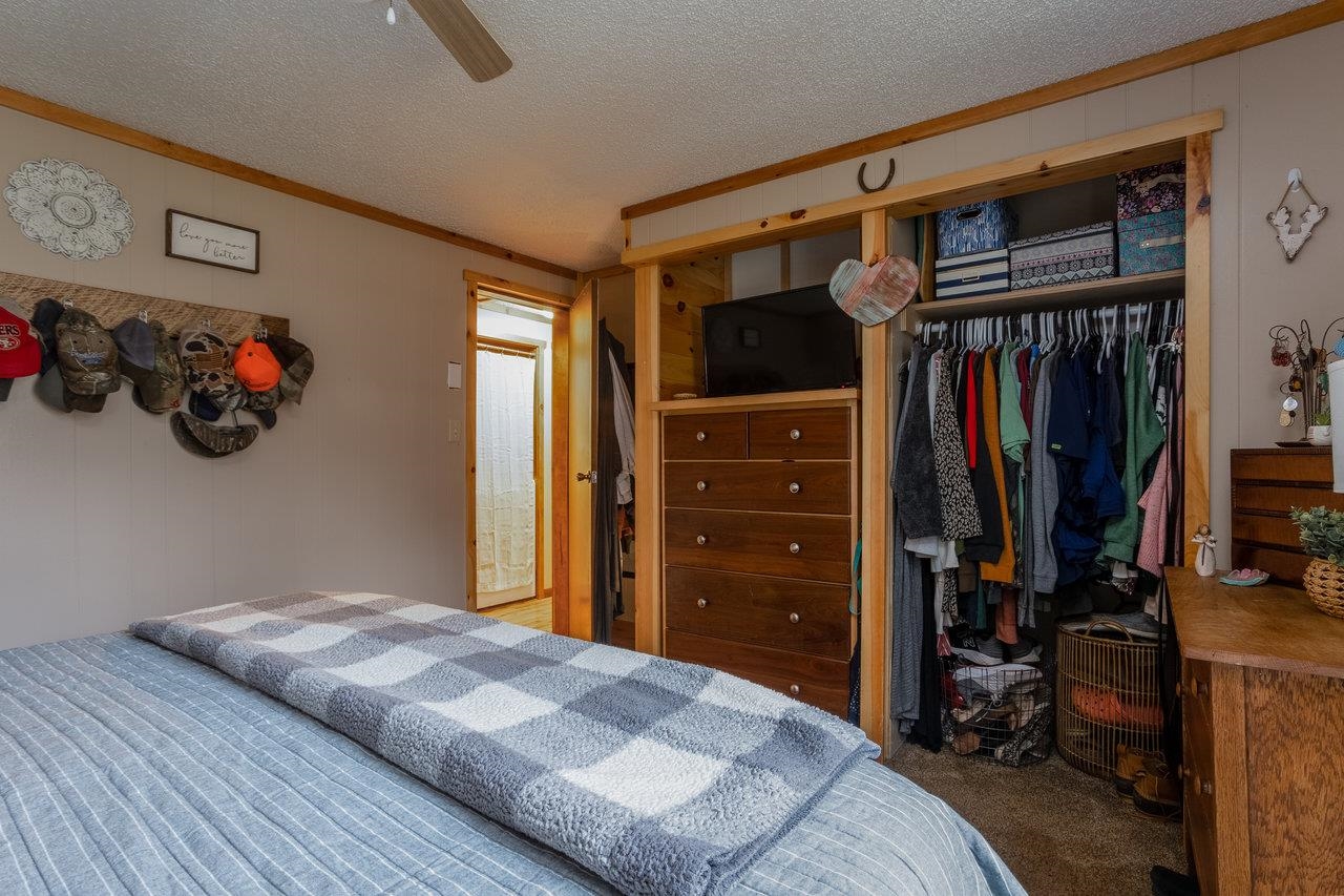8448 Briery Branch Road Dayton, VA 22821 - Photo 21 of 37 a bedroom with a bed and a walk in closet