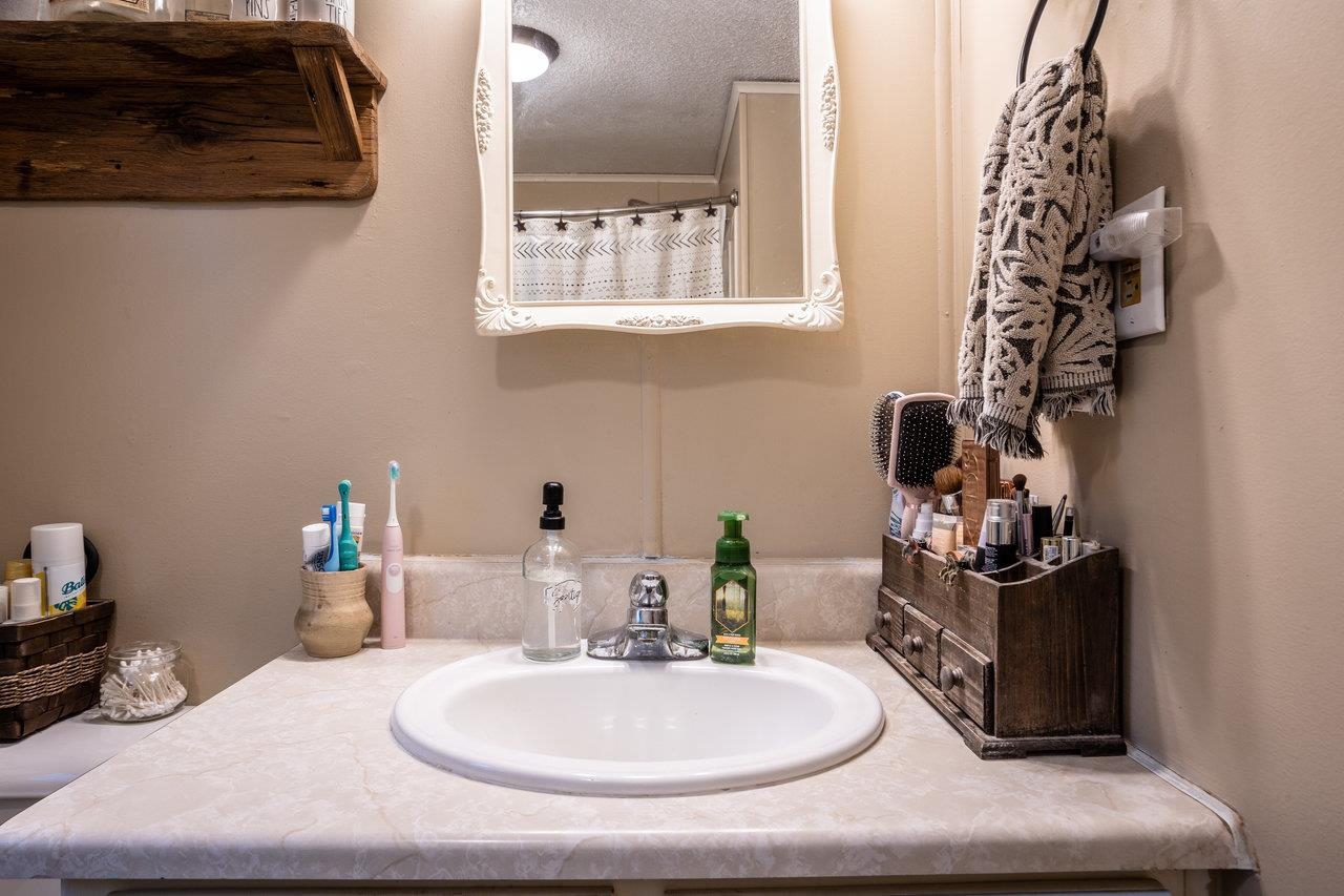 8448 Briery Branch Road Dayton, VA 22821 - Photo 25 of 37 a bathroom with a sink and a mirror