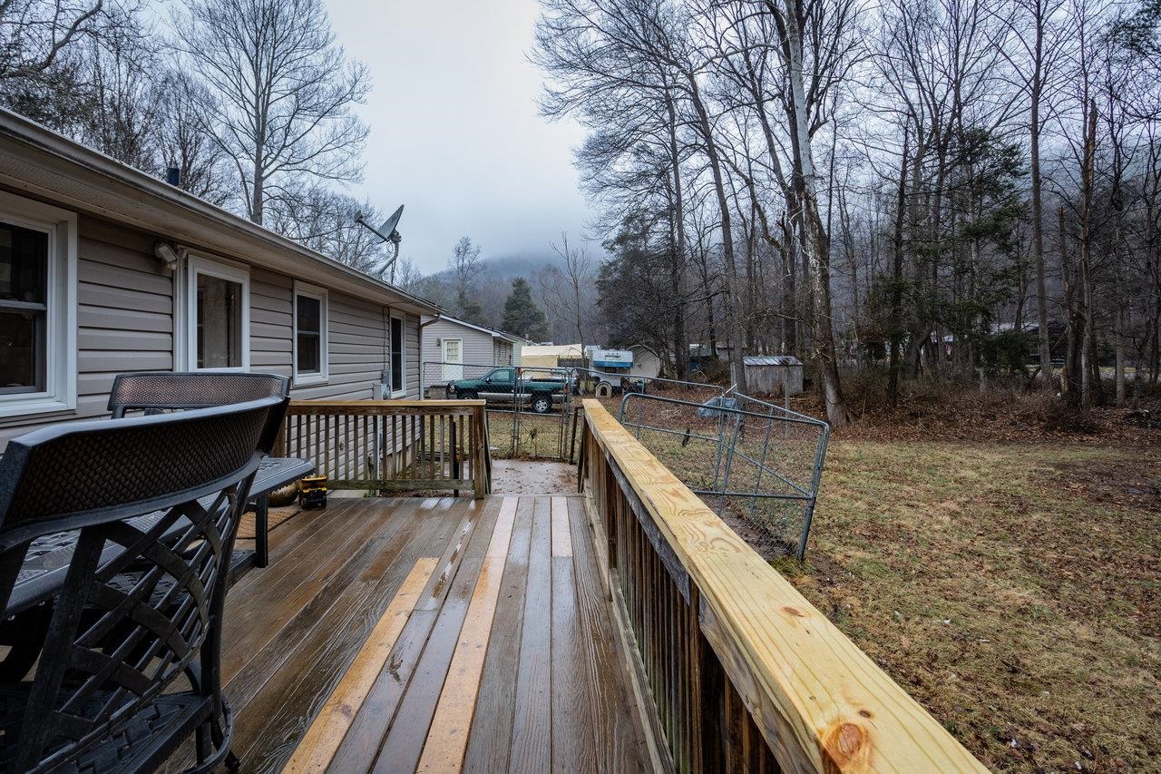 8448 Briery Branch Road Dayton, VA 22821 - Photo 34 of 37 a balcony with wooden floor and outdoor seating