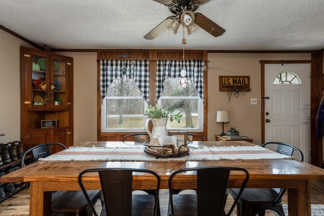 8448 Briery Branch Road Dayton, VA 22821 - Photo 4 of 37 a kitchen with a table and chairs