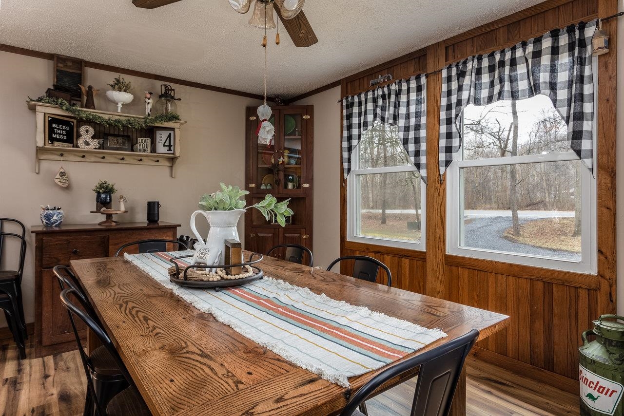 8448 Briery Branch Road Dayton, VA 22821 - Photo 6 of 37 a dining room with wooden floor