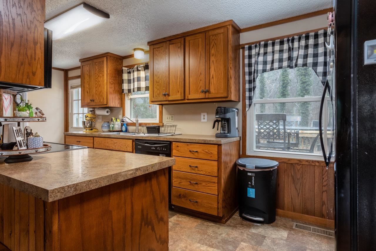 8448 Briery Branch Road Dayton, VA 22821 - Photo 8 of 37 a kitchen with a refrigerator stove and sink