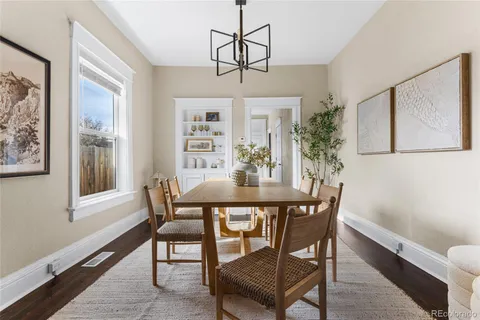 a view of a dining room with furniture window and wooden floor