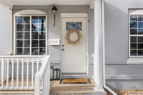 a view of a door and a window