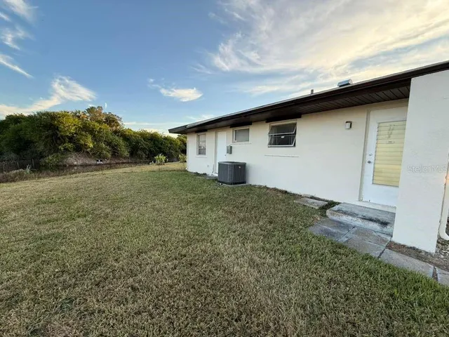 a view of a backyard of the house