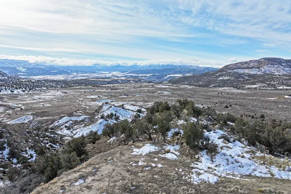 an aerial view of residential house and mountains