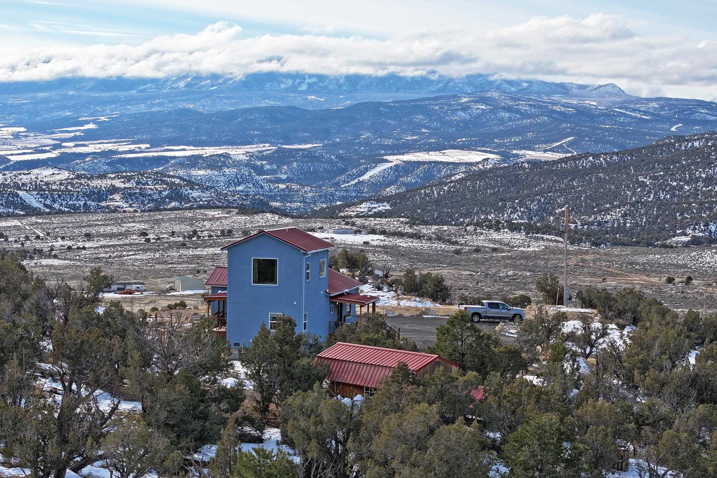 15086-45 45 1/2 Road De Beque, CO 81630 - Photo 32 of 40 a view of a house with a yard