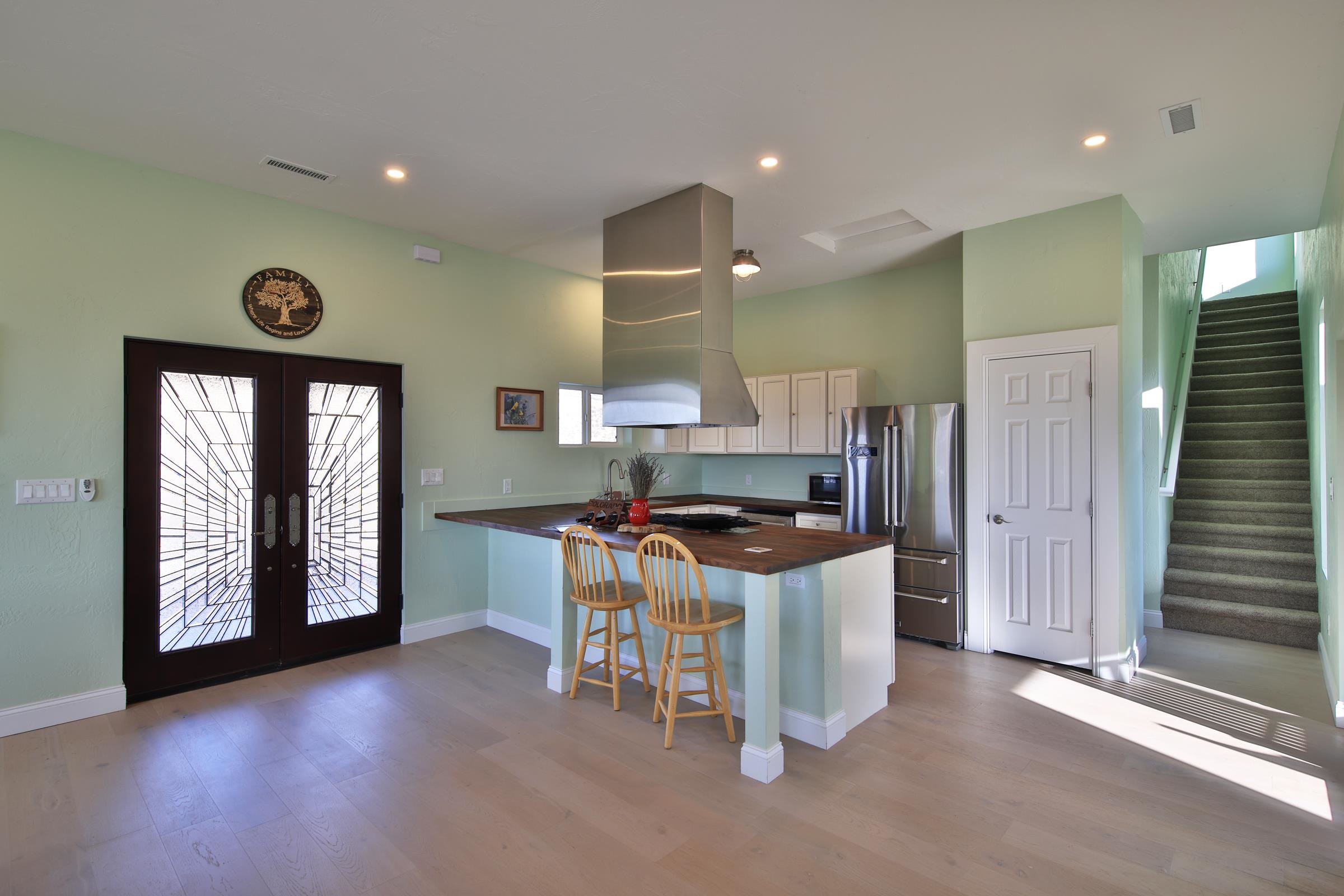 15086-45 45 1/2 Road De Beque, CO 81630 - Photo 6 of 40 a kitchen with a stove a refrigerator and a sink