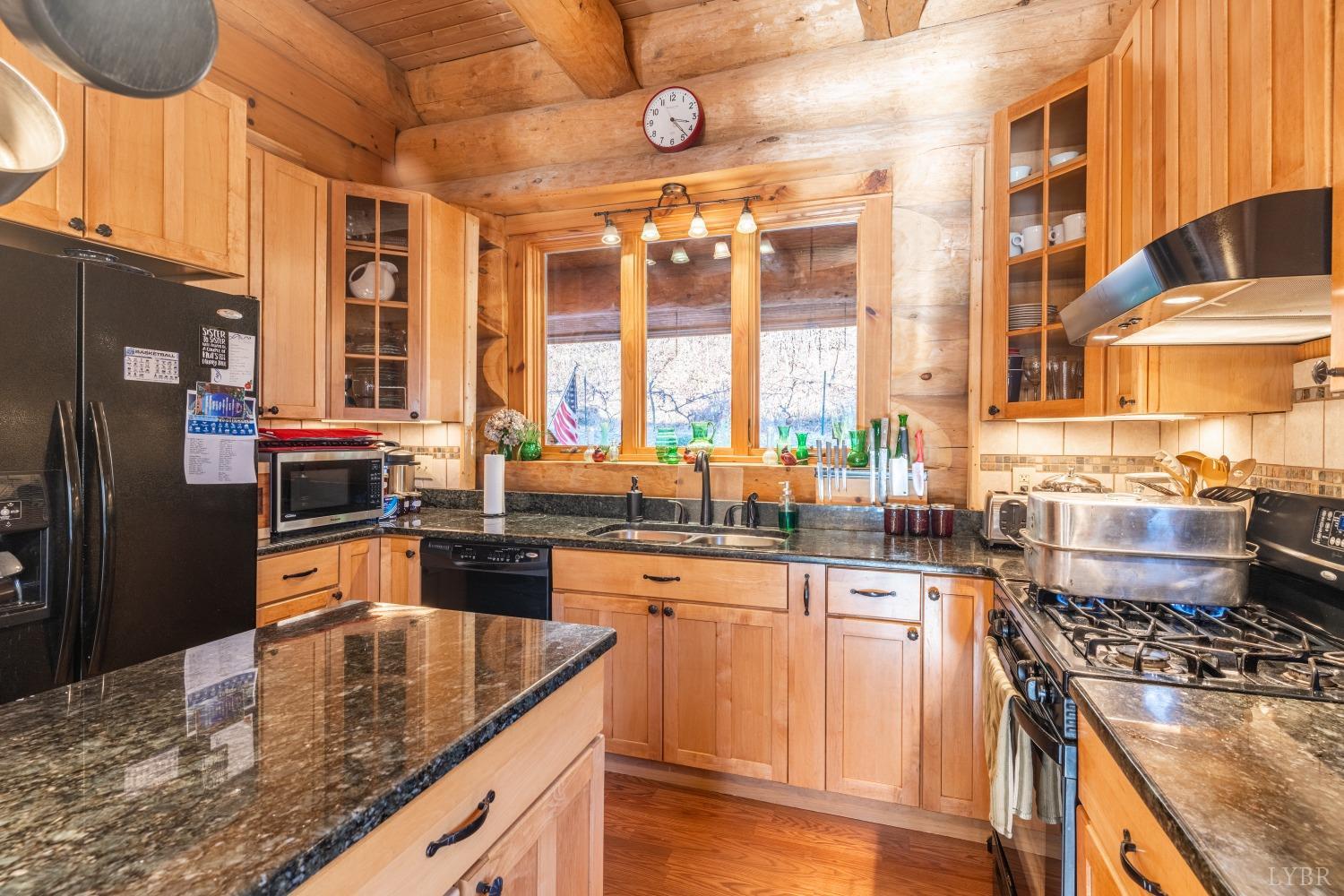 1151 Mt Horeb Road Amherst, VA 24521 - Photo 21 of 98 a kitchen with stainless steel appliances granite countertop a stove a sink and a refrigerator