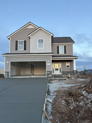 a front view of a house with garage