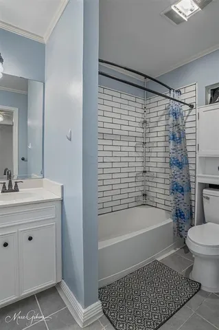 a bathroom with a toilet a sink and bathtub