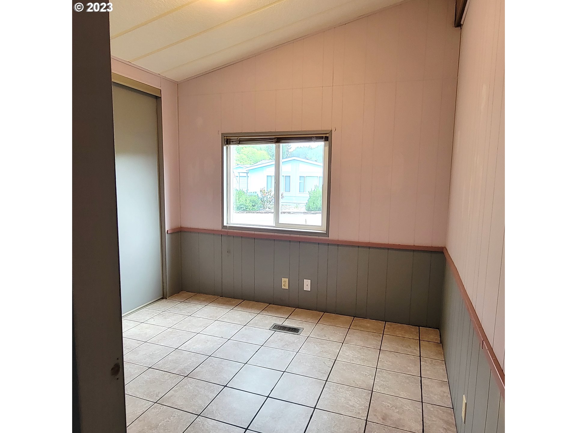 100 River Bend Road, Unit 6 Reedsport, OR 97467 - Photo 17 of 26 a view of an empty room with a window