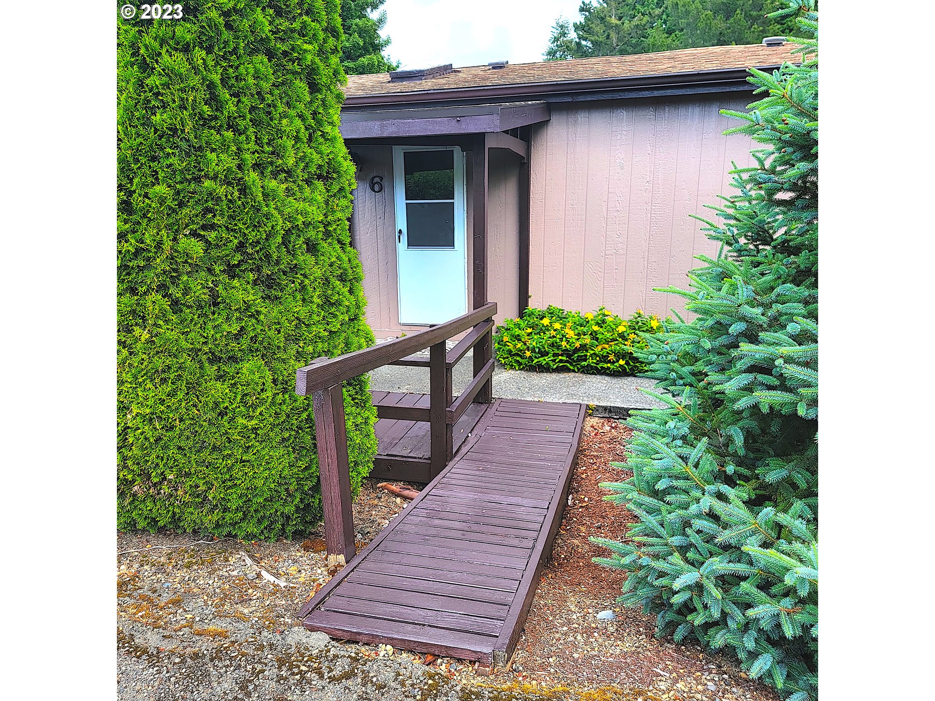100 River Bend Road, Unit 6 Reedsport, OR 97467 - Photo 24 of 26 a view of a pathway with a house
