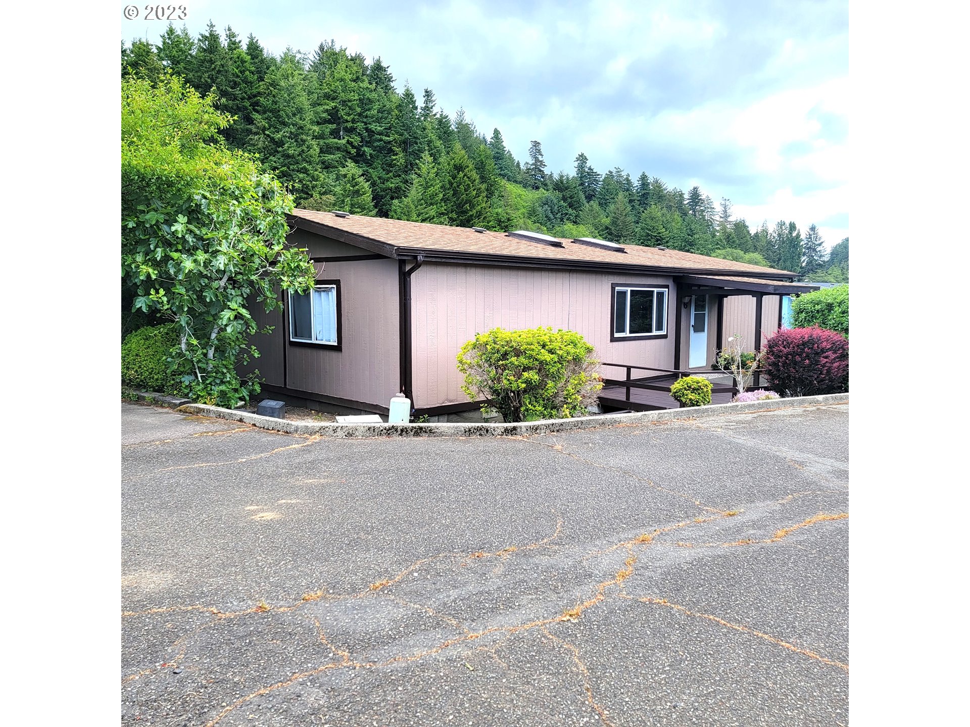 100 River Bend Road, Unit 6 Reedsport, OR 97467 - Photo 26 of 26 a house view with a outdoor space