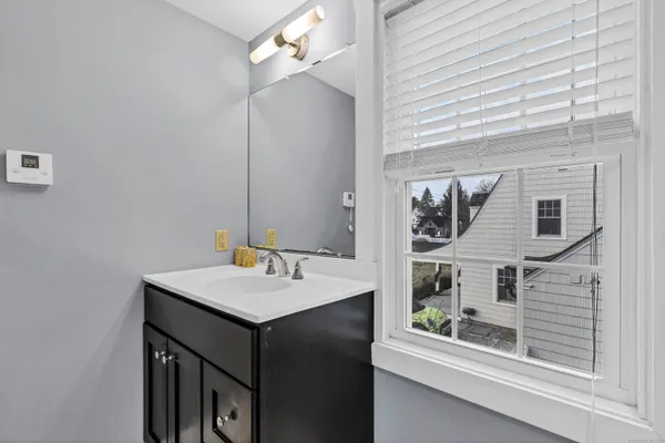 a bathroom with a shower and a bath tub
