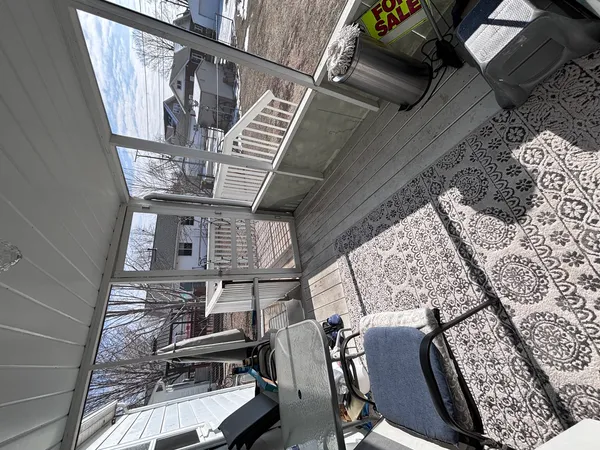 a view of a balcony with chairs
