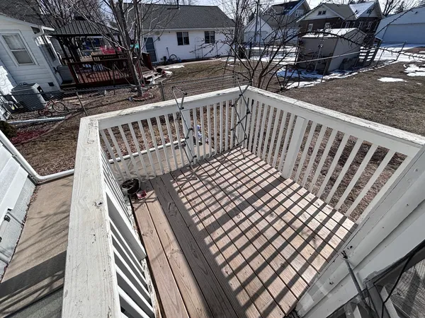 a view of balcony with wooden floor