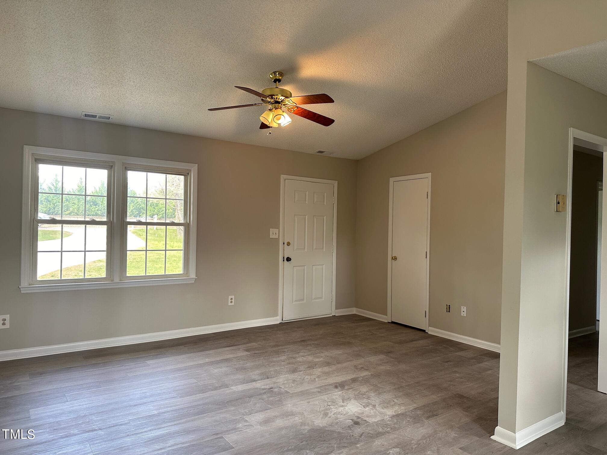 3309 Banks Road Raleigh, NC 27603 - Photo 3 of 11 a view of an empty room with a window
