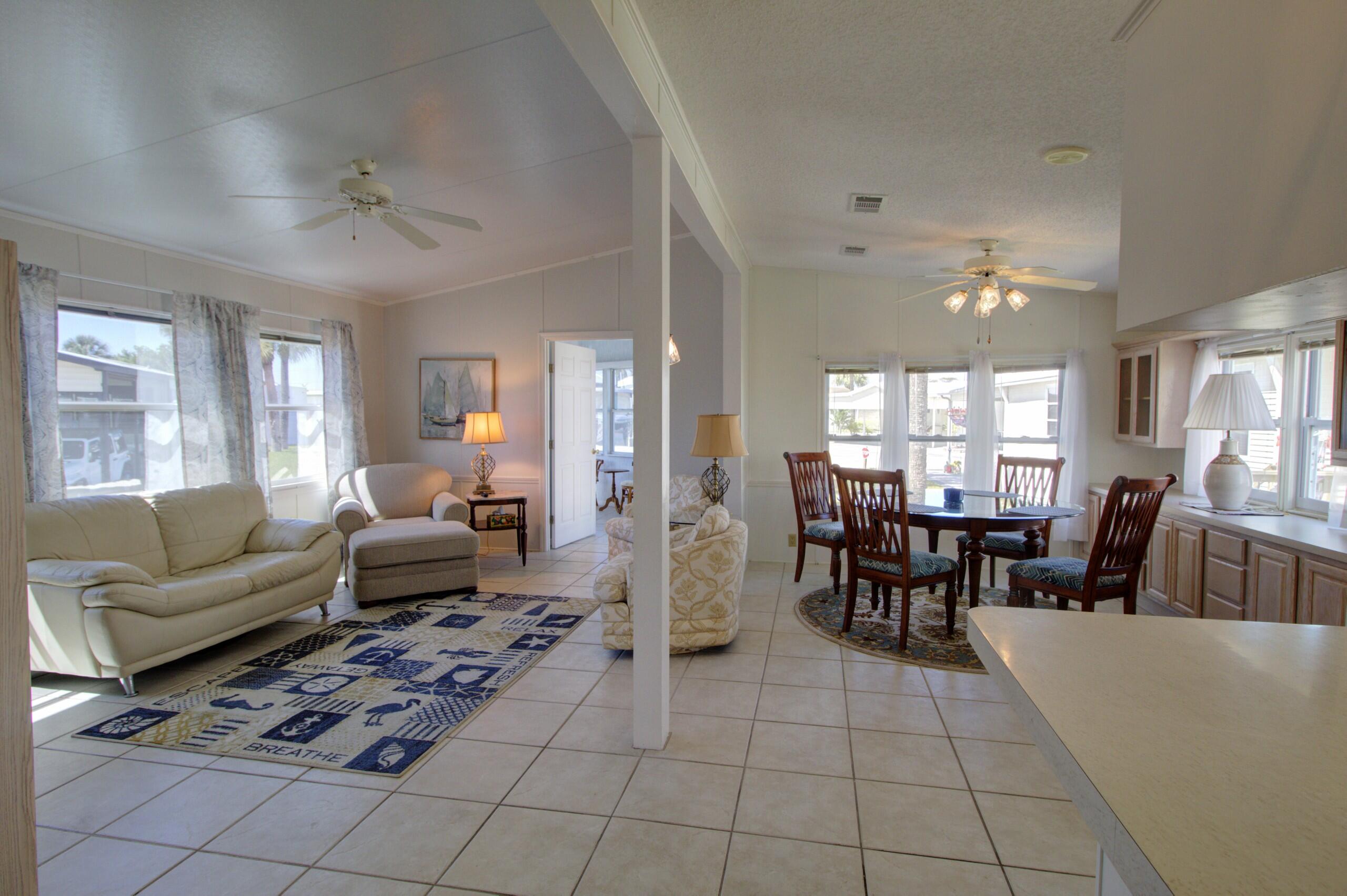 5395 Southeast 64th Terrace Okeechobee, FL 34974 - Photo 12 of 24 a living room with furniture and a dining table