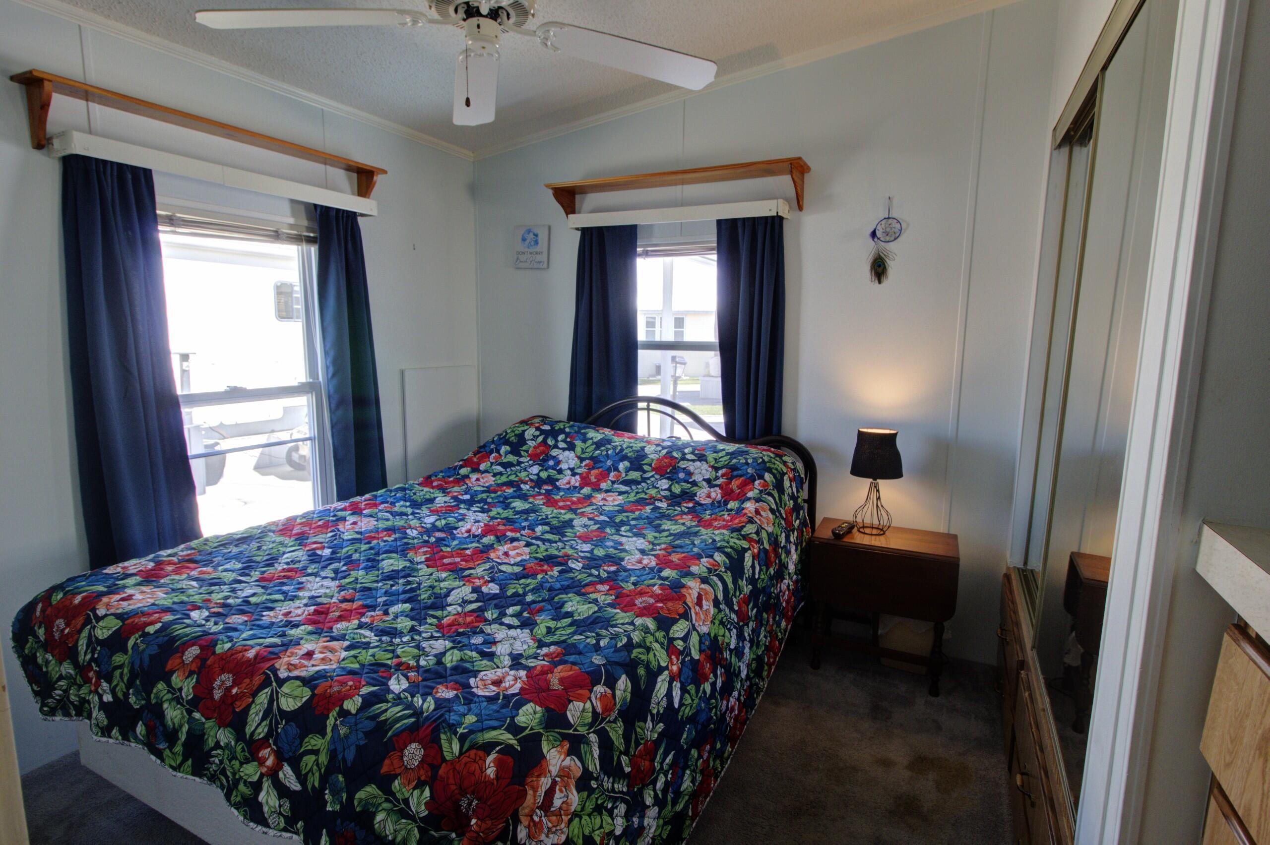 5395 Southeast 64th Terrace Okeechobee, FL 34974 - Photo 13 of 24 a bedroom with bed and window