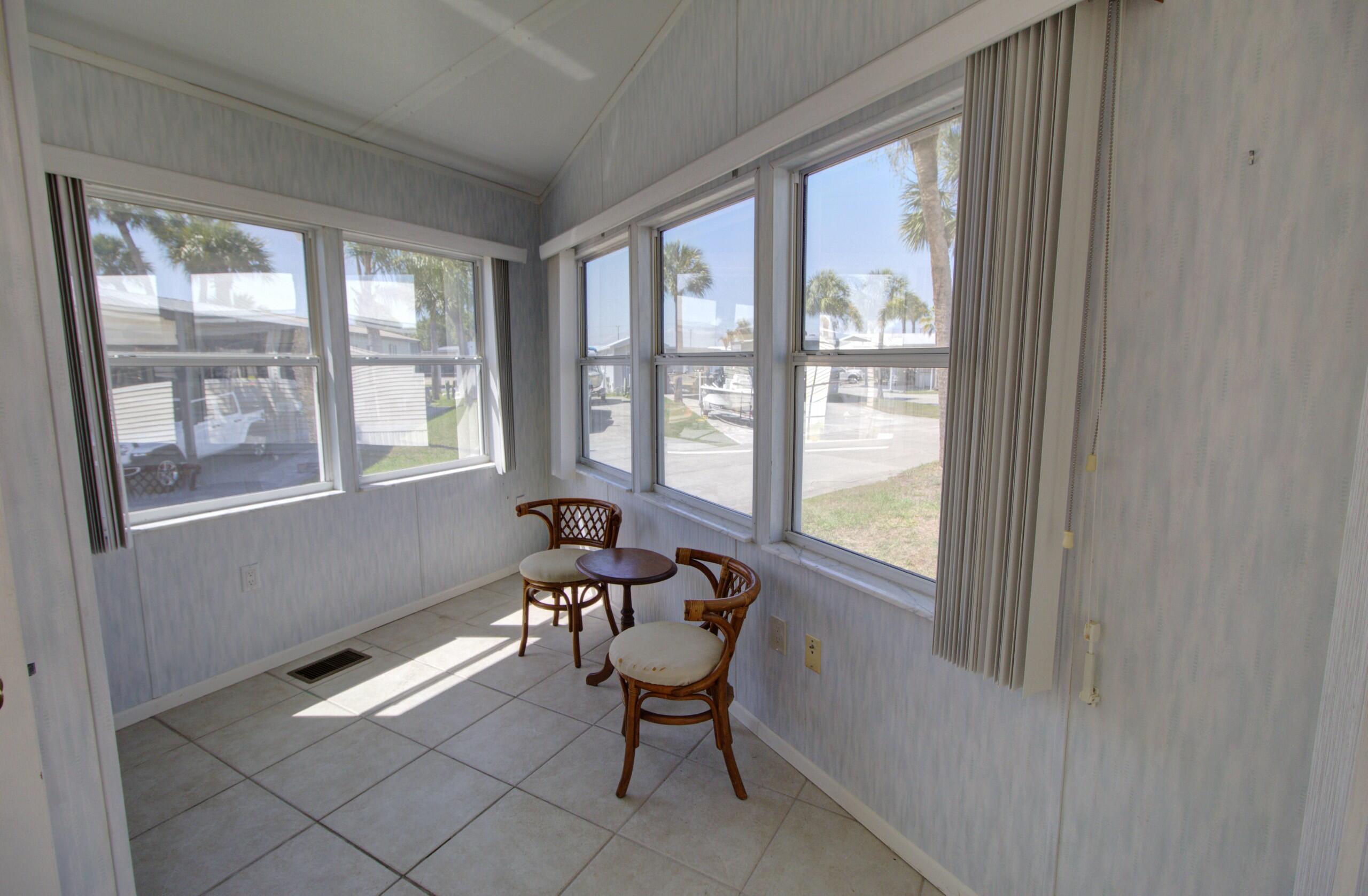 5395 Southeast 64th Terrace Okeechobee, FL 34974 - Photo 18 of 24 a view of a room that has a window and furniture