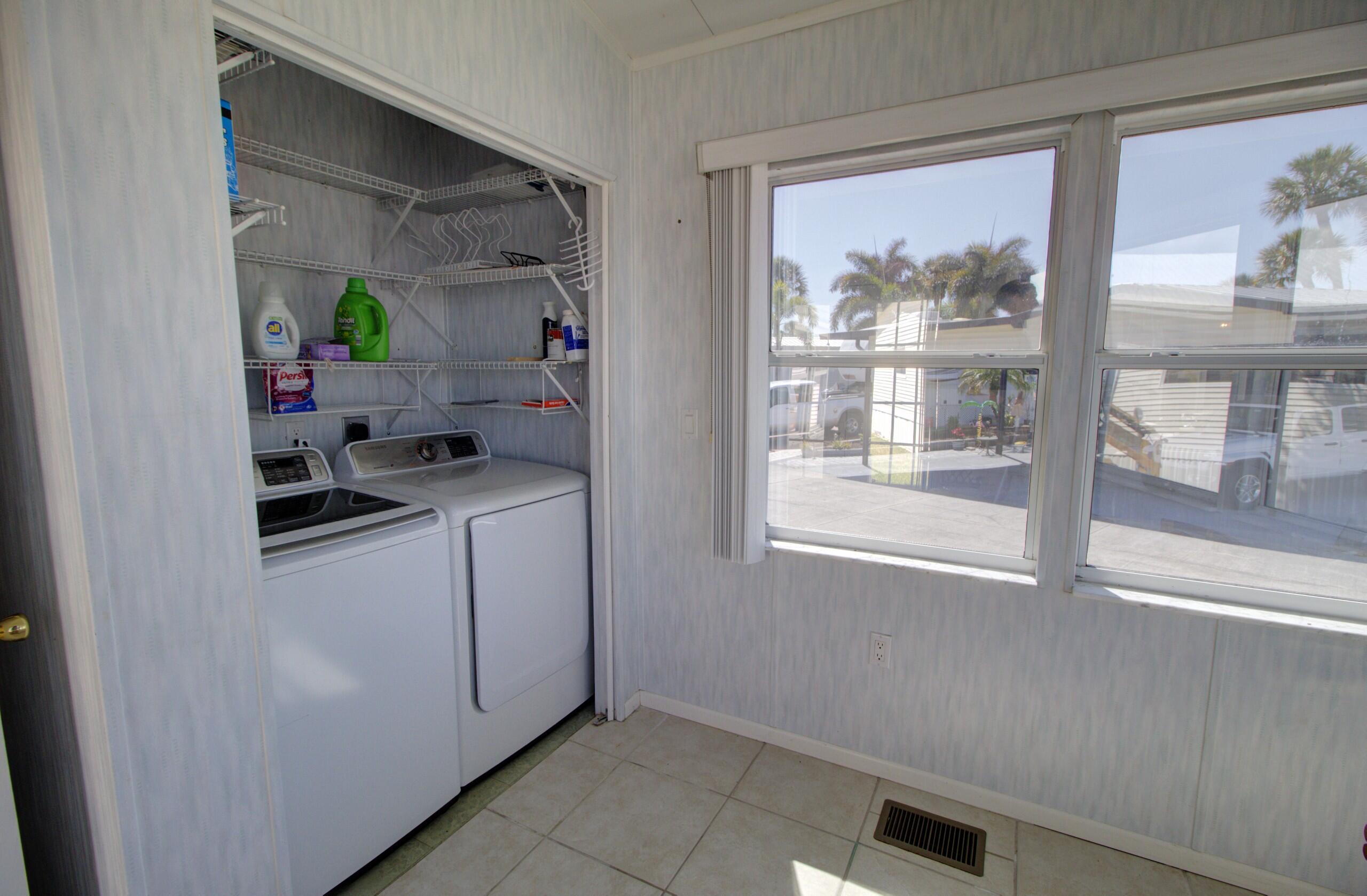 5395 Southeast 64th Terrace Okeechobee, FL 34974 - Photo 19 of 24 a storage room with washer and dryer