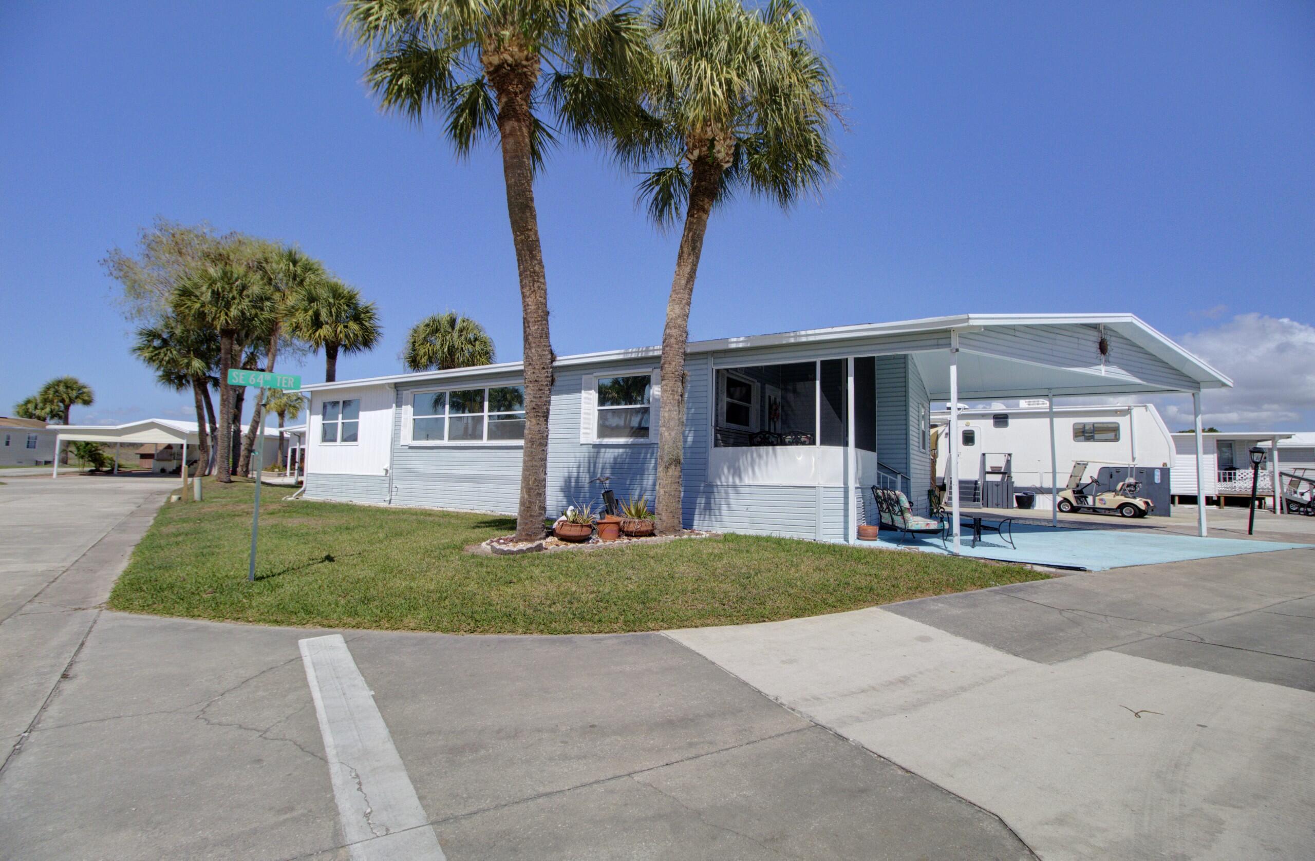 5395 Southeast 64th Terrace Okeechobee, FL 34974 - Photo 2 of 24 a view of a house with a yard