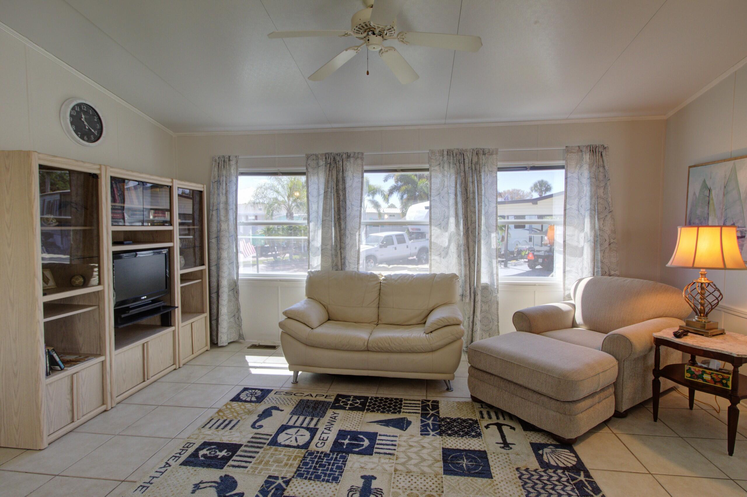 5395 Southeast 64th Terrace Okeechobee, FL 34974 - Photo 4 of 24 a living room with furniture and a window