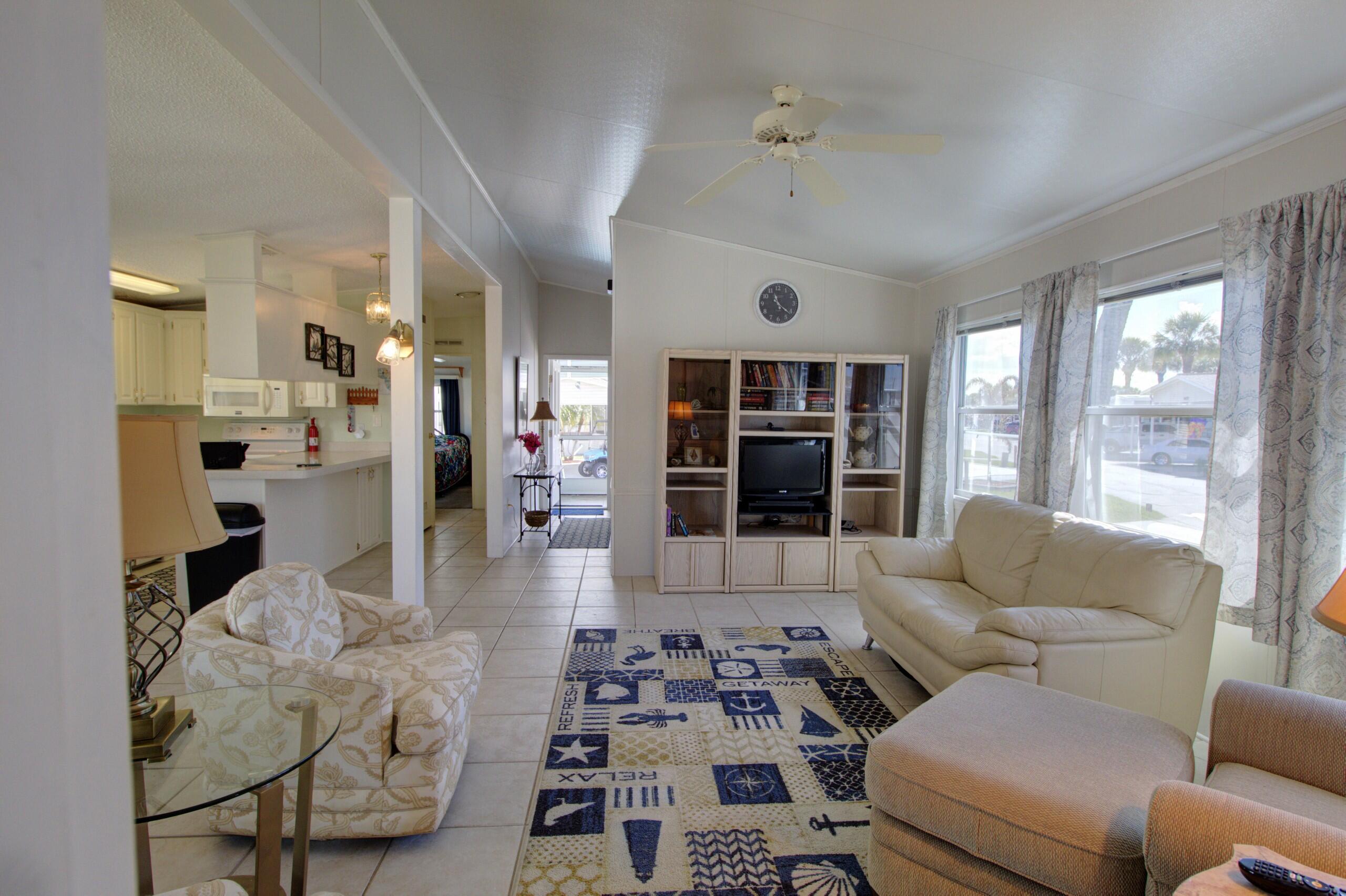 5395 Southeast 64th Terrace Okeechobee, FL 34974 - Photo 5 of 24 a living room with furniture and a large window