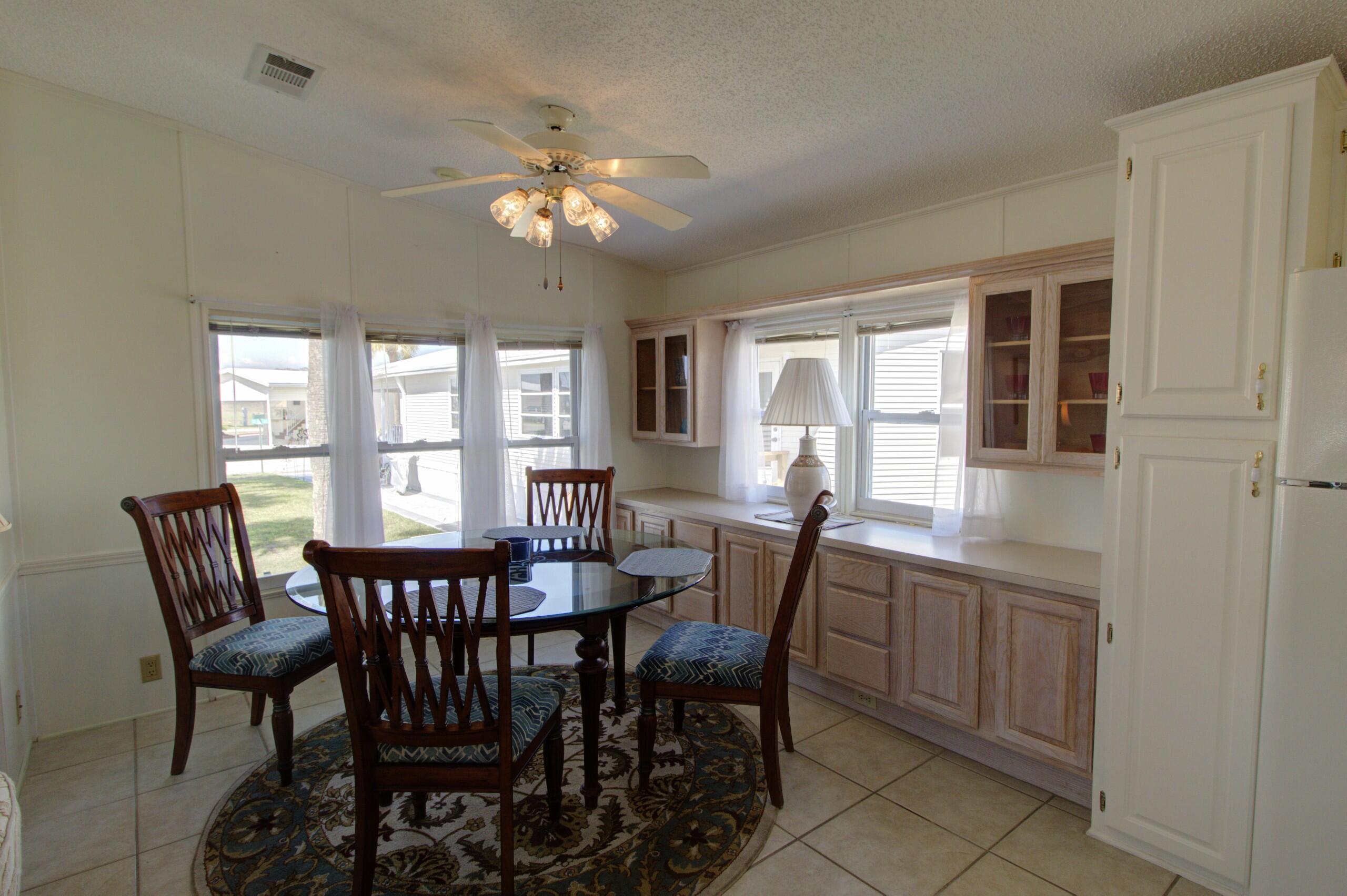 5395 Southeast 64th Terrace Okeechobee, FL 34974 - Photo 7 of 24 a view of a dining room with furniture and window