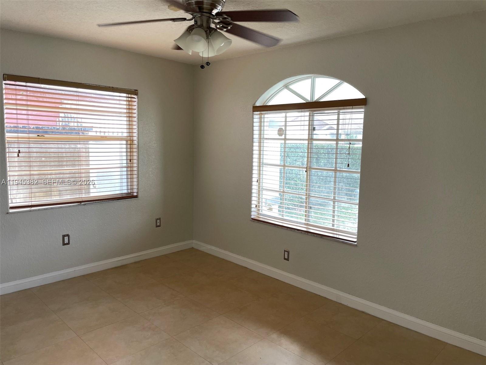 3559 West 74th Place Hialeah, FL 33018 - Photo 11 of 16 a view of an empty room with a window