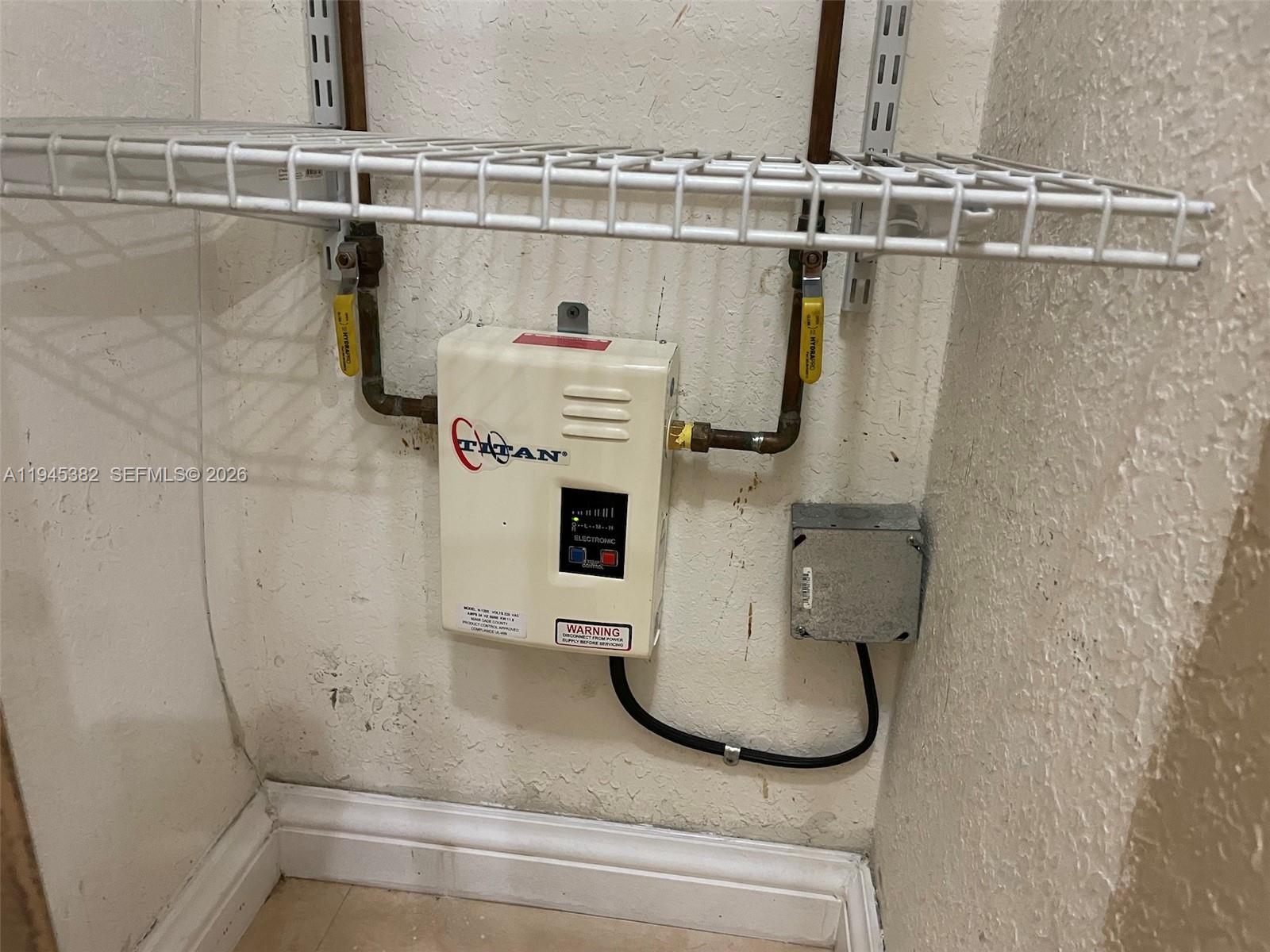 3559 West 74th Place Hialeah, FL 33018 - Photo 16 of 16 a bathroom with a sink and mirror