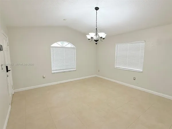 a view of empty room with windows