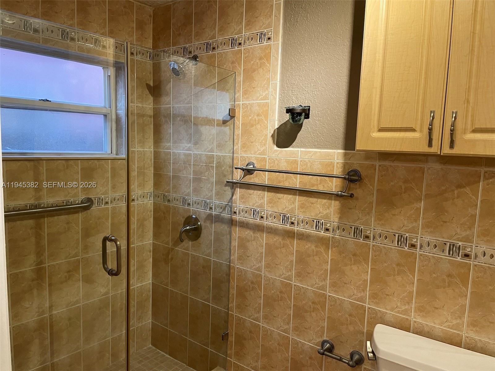 3559 West 74th Place Hialeah, FL 33018 - Photo 8 of 16 a bathroom with a shower