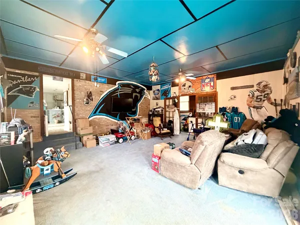 a view of a garage with a bike and a car