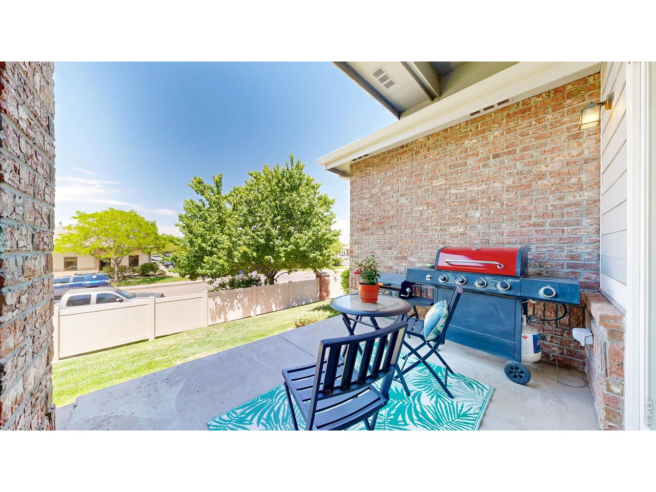 4672 West 20th Road, Unit 413 Greeley, CO 80634 - Photo 30 of 37 a balcony with table and chairs