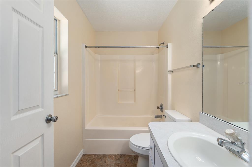 4329 Northwest 155th Street Reddick, FL 32686 - Photo 33 of 52 a bathroom with a sink toilet and shower